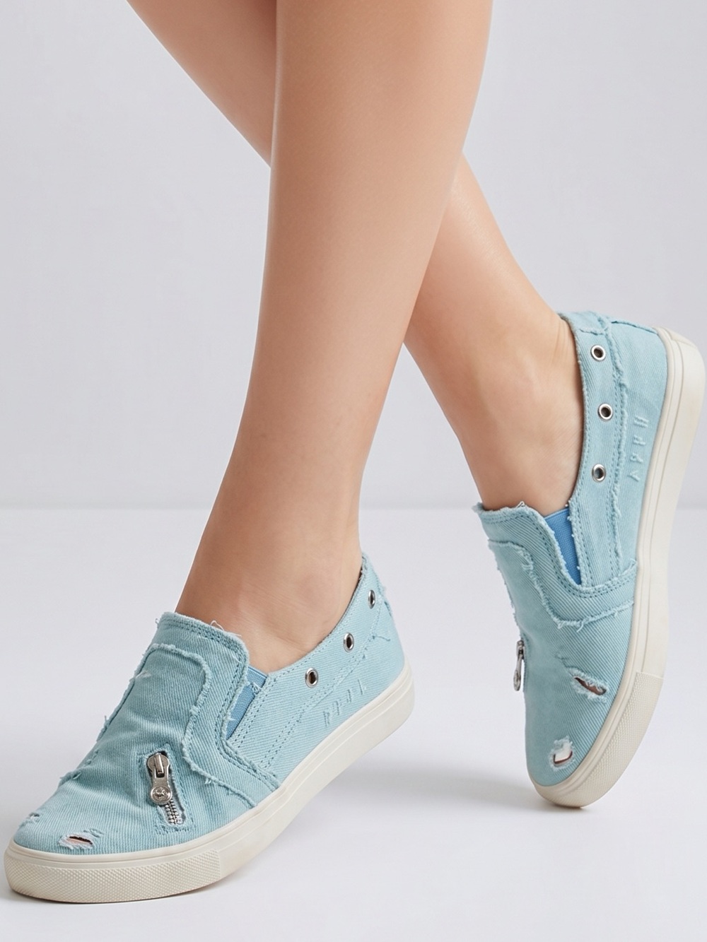 Light blue denim distressed slip on sneakers. Size 10 /40‎